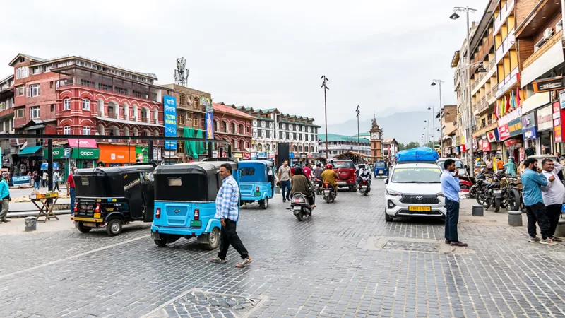 Traffic zips around Srinagar's central plaza, Lal Chowk ("Red Square")