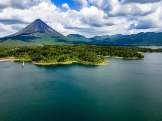 Arenal Volcano National Park, with Arenal Lake in the foreground.