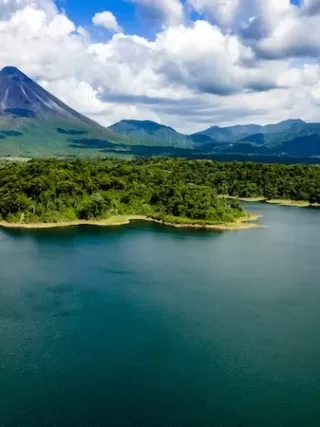 Arenal Volcano National Park, with Arenal Lake in the foreground.