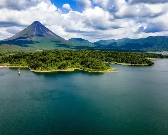 Arenal Volcano National Park, with Arenal Lake in the foreground.